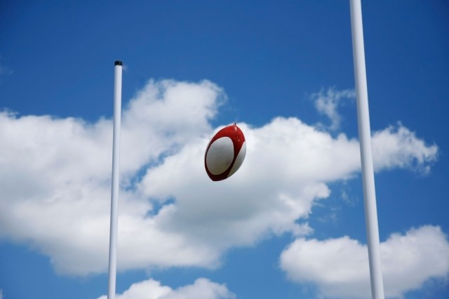 Rugby union ball between the poles